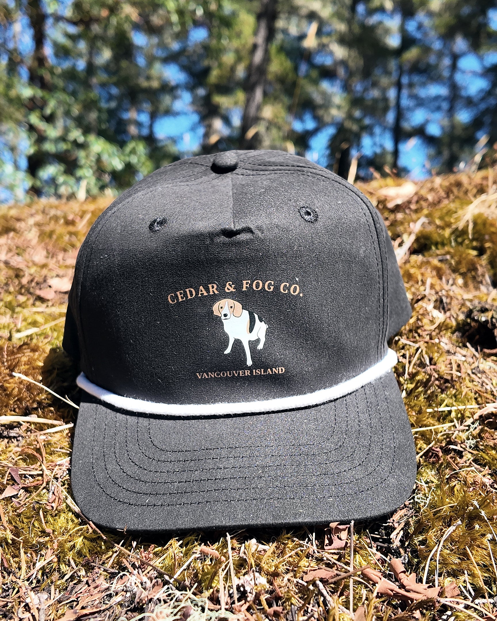 The Georgia Cap in black with the Cedar & Fog Co. coonhound embroidery and white rope detail