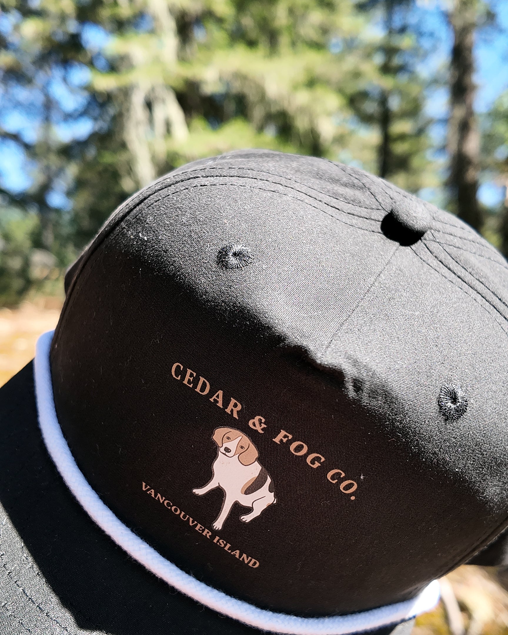 The Georgia Cap in black, angled view showing the rope detail across the brim