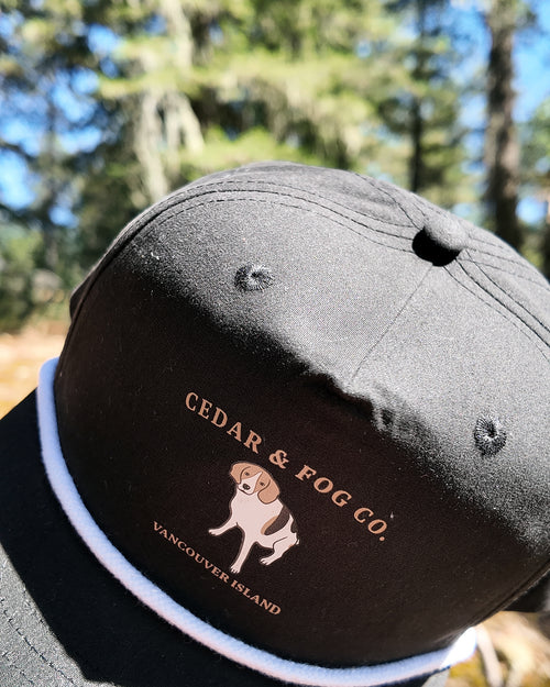 The Georgia Cap in black, angled view showing the rope detail across the brim
