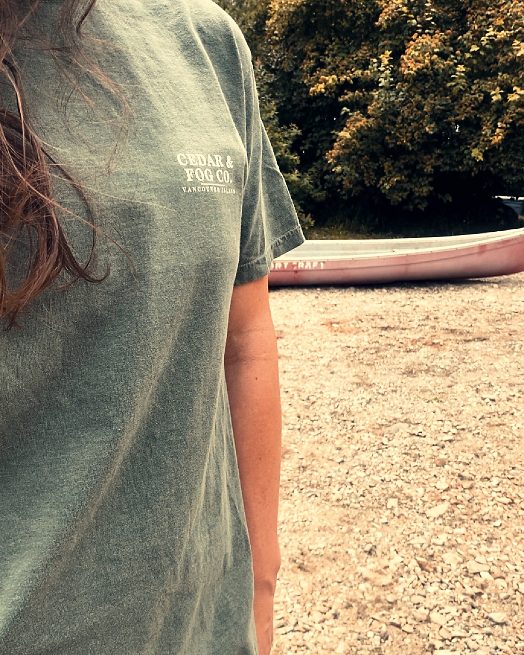 The Long Haul Tee in moss worn on the beach, Vancouver Island