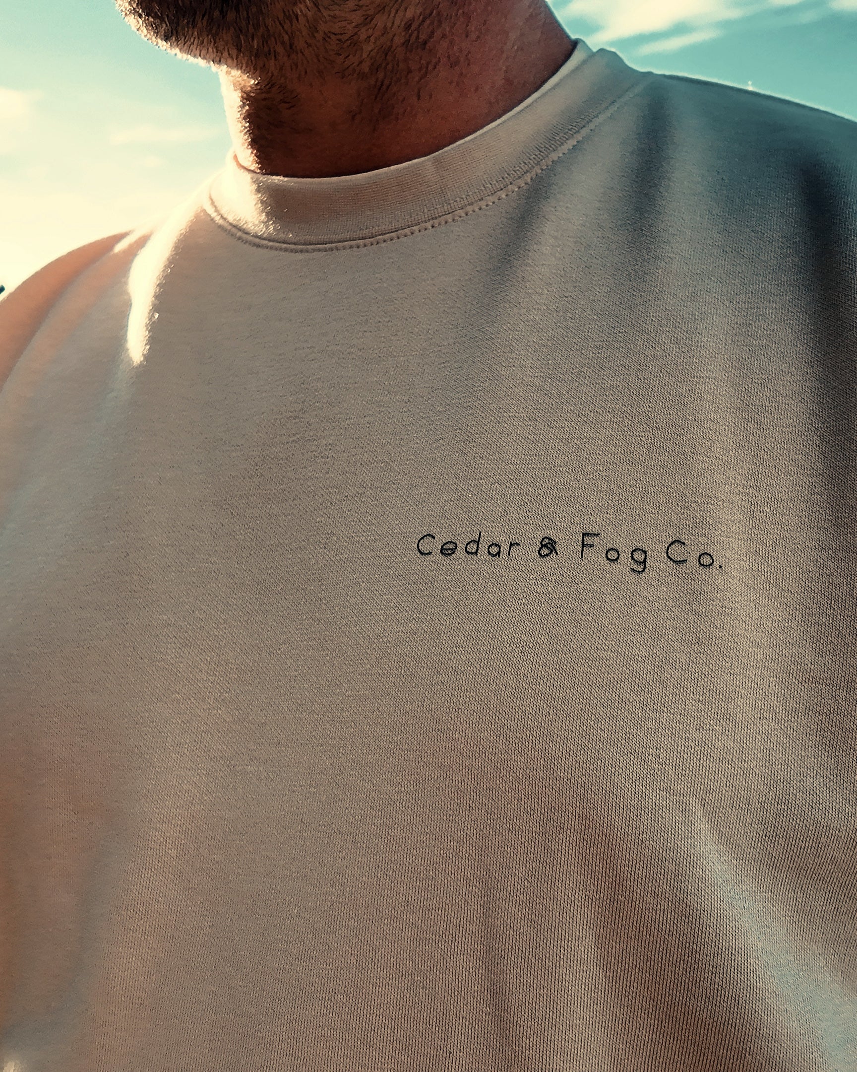 Close-up of the hand-lettered Cedar & Fog Co. wordmark on The Cabin Crew in bone
