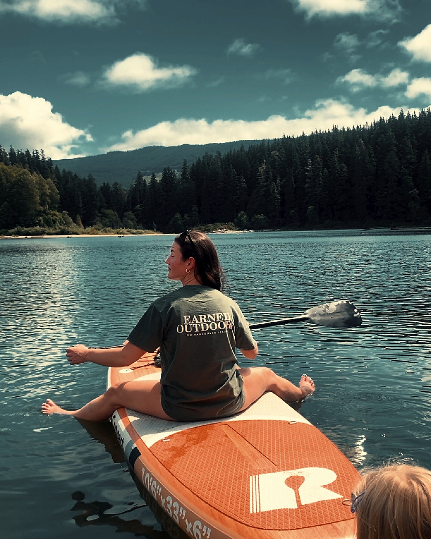 The Long Haul Tee in moss worn paddleboarding on Vancouver Island