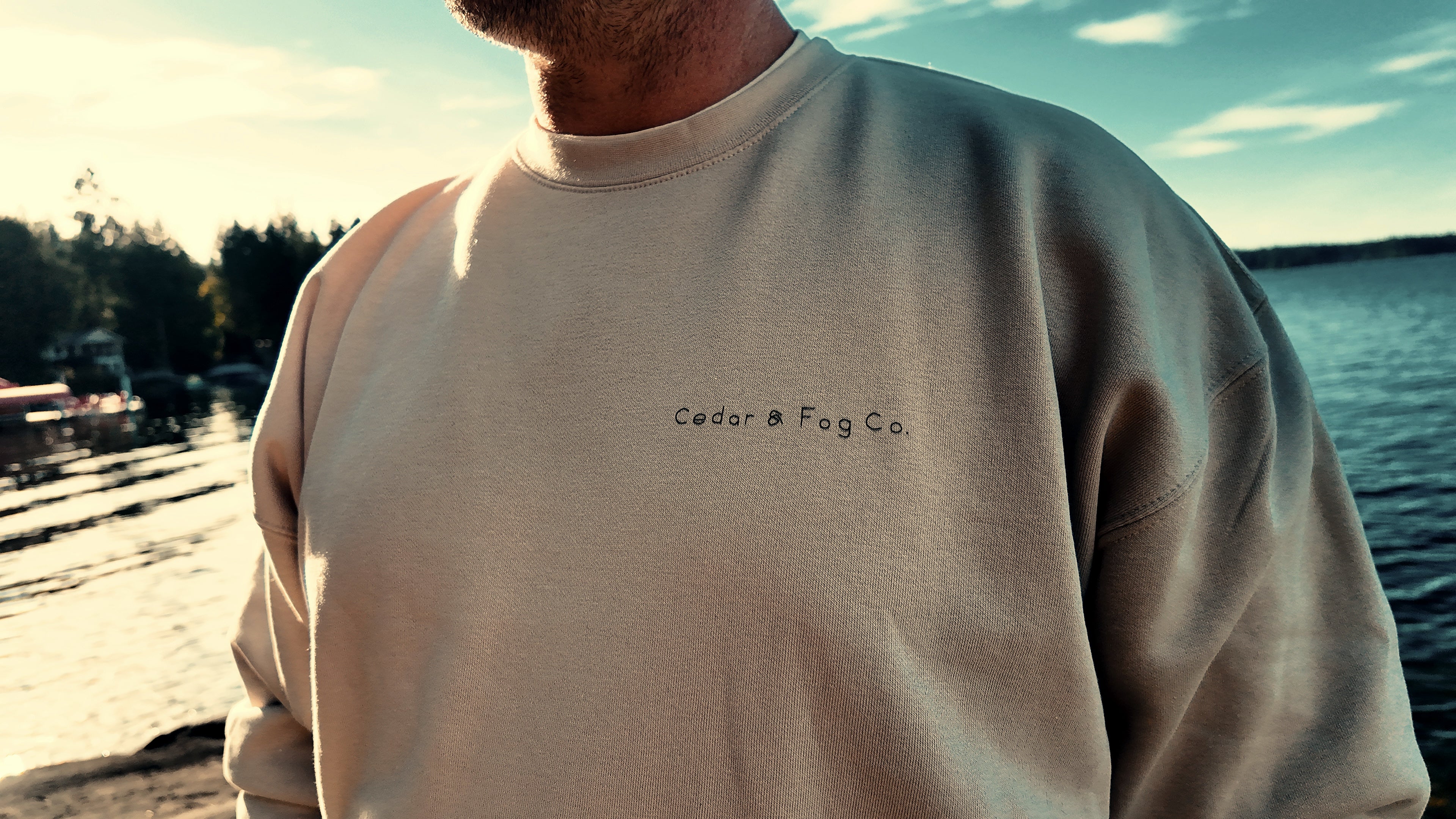 Close-up of the hand-lettered Cedar & Fog Co. wordmark on The Cabin Crew in bone